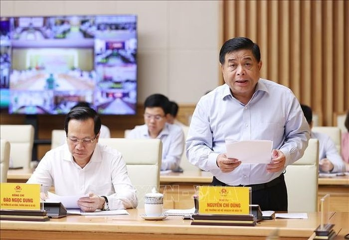 Bộ trưởng Bộ Kế hoạch và Đầu tư Nguyễn Chí Dũng báo cáo tình hình phát triển doanh nghiệp 7 tháng đầu năm 2022. Ảnh: Dương Giang/TTXVN