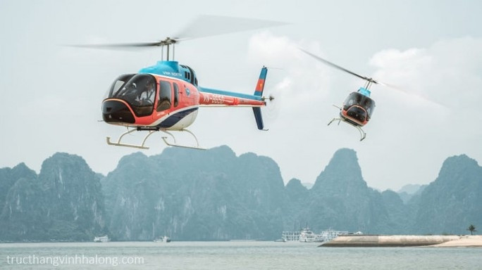 Tạm dừng dịch vụ ngắm cảnh bằng trực thăng trên cả nước sau vụ rơi máy bay - Ảnh 2.