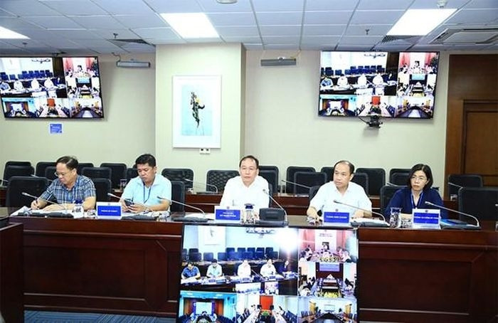 Đại tá Đỗ Mạnh Khảm, Tổng giám đốc Tổng công ty Đông Bắc (ngồi giữa) cho biết sẽ phối hợp với EVN đảm bảo than cho phát điện. (Nguồn: EVN)