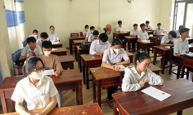 Học sinh thi vào lớp 10 trường Trường THPT chuyên Nguyễn Bỉnh Khiêm tháng 6/2023. Ảnh: Phú Xuân