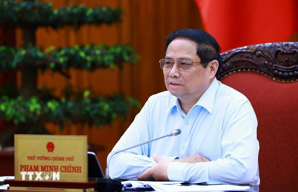 Thủ tướng Phạm Minh Chính chủ trì họp thúc đẩy tiến độ triển khai dự án đường dây 500kv mạch 3 và cung ứng điện tháng cao điểm. (Ảnh: Dương Giang/TTXVN)