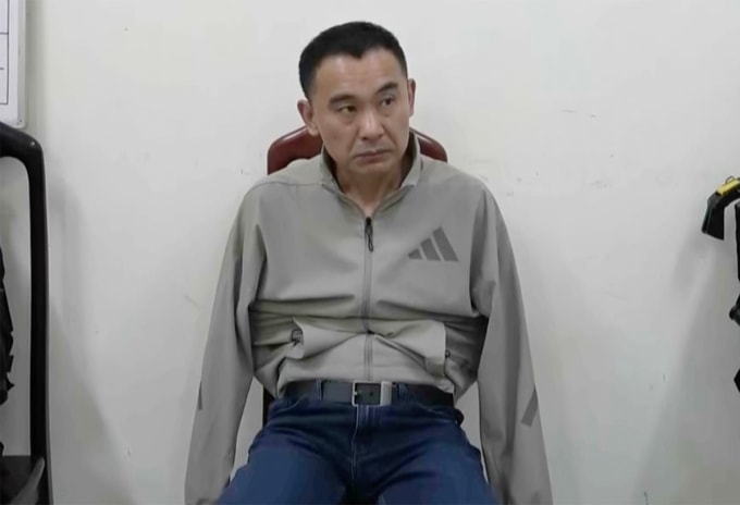 Trương Xuân Minh - nghi phạm cầm đầu đường dây lúc bị bắt. Ảnh: Huy Hà