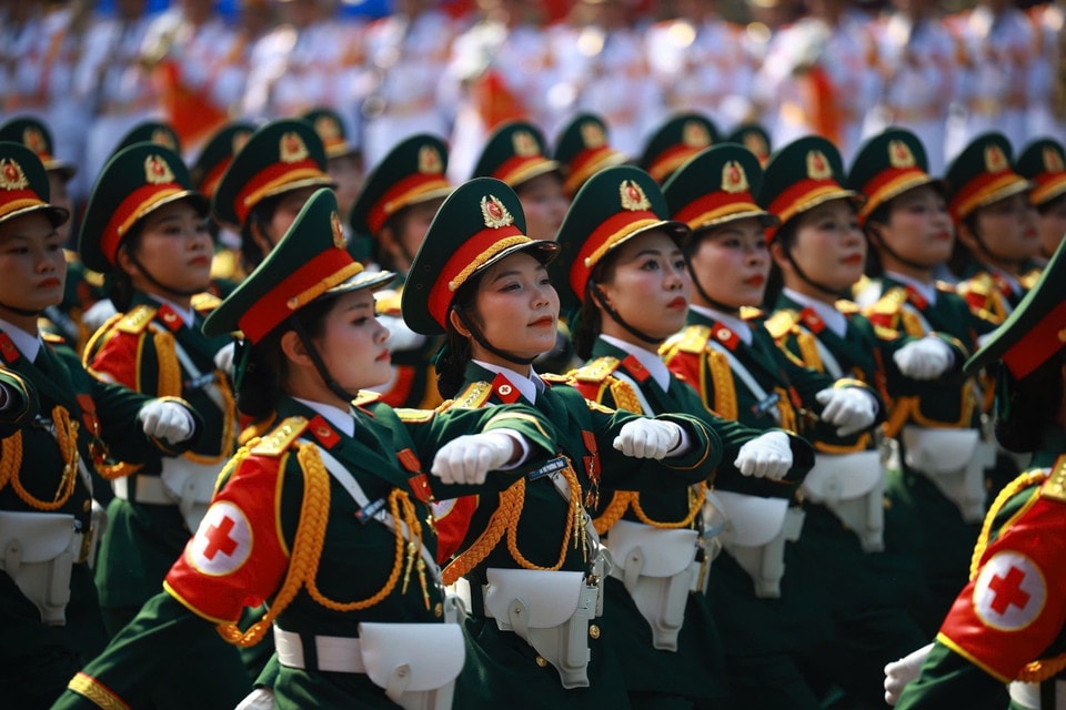 The female Military Medical officers march past the grandstand. Photo: VNA
