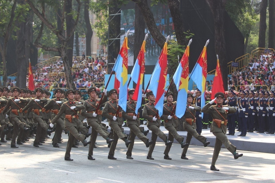 A formation of officers representing the five military fronts marches past the grandstand. Photo: VNA