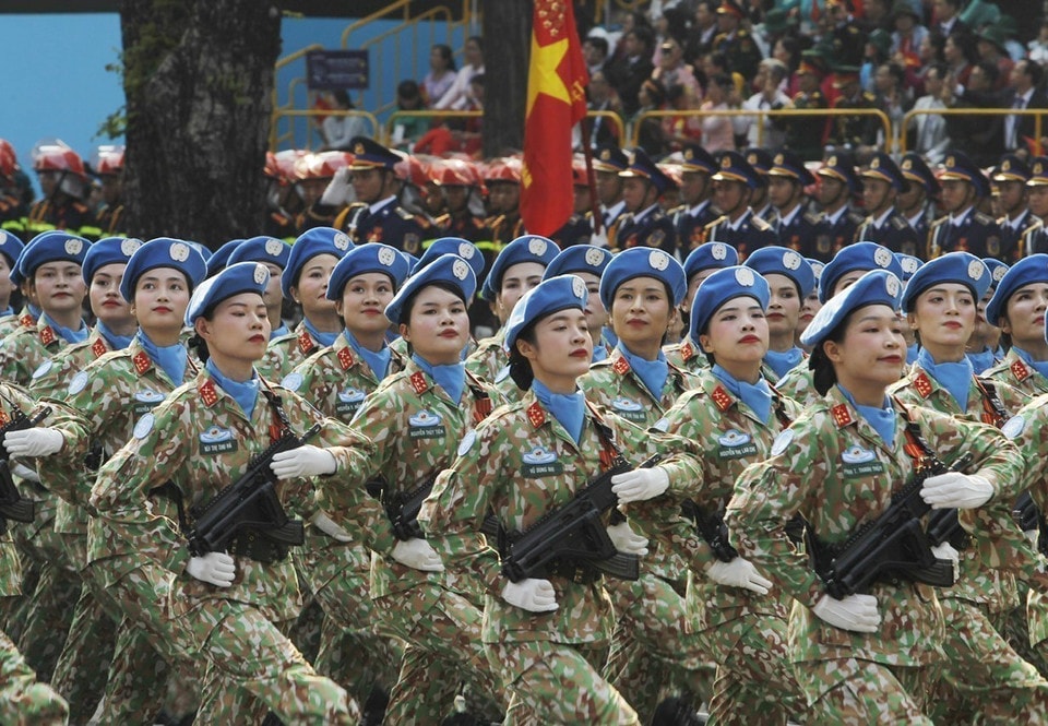 The female Peacekeepers march past the grandstand. Photo: VNA