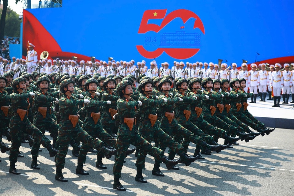 The female Signal Corps officers march past the grandstand. Photo: VNA