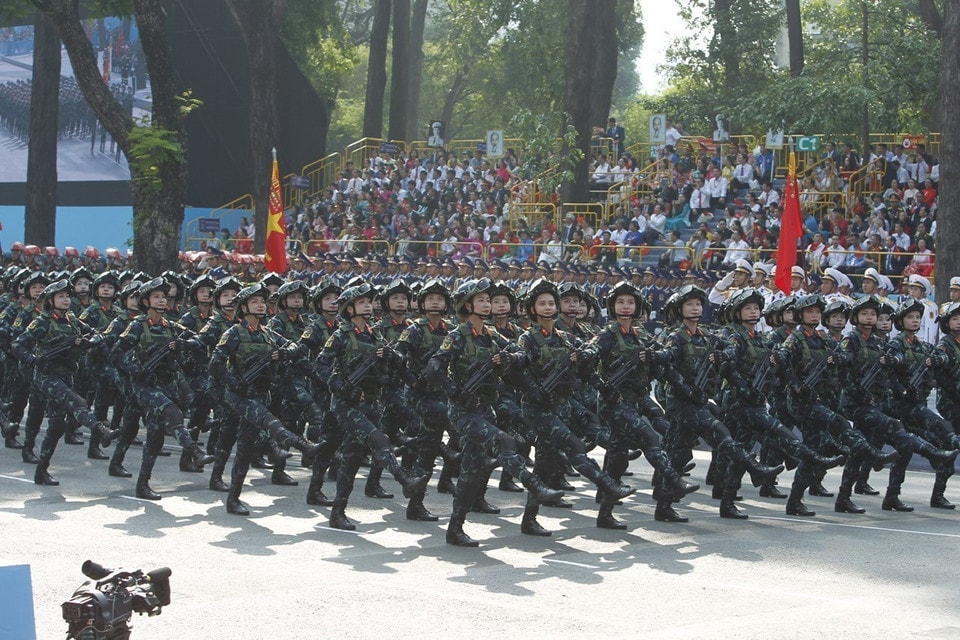 The female Guerilla fighters march past the grandstand. Photo: VNA