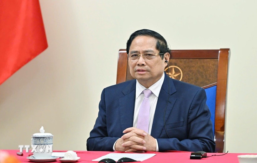 Thủ tướng Phạm Minh Chính điện đàm với Thủ tướng Malaysia Anwar Ibrahim. (Ảnh: Dương Giang/TTXVN)