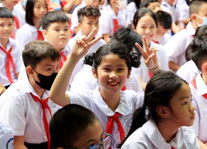 Học sinh ở Thành phố Hồ Chí Minh vui mừng chào đón Năm học mới 2023-2024. (Ảnh: Hồng Đạt/TTXVN)
