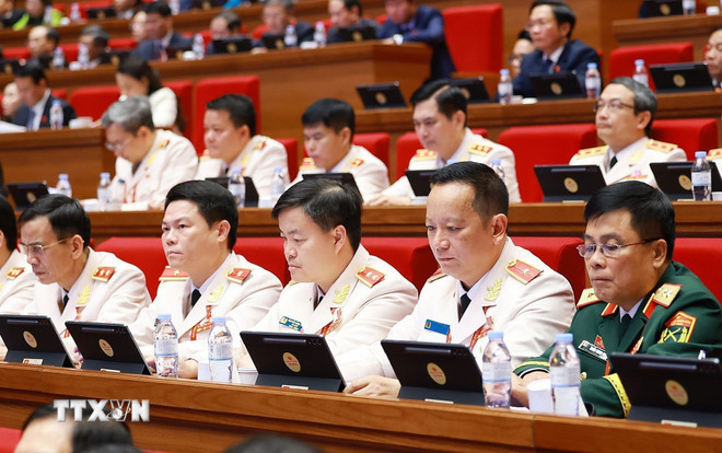 Đoàn đại biểu Đảng bộ Công an Trung ương dự phiên thảo luận tại hội trường về các văn kiện Đại hội, chiều 21/1. (Ảnh: TTXVN) ttxvn-2101-thao-luan-hoi-truong-van-kien-dai-hoi-dang-7.jpg
