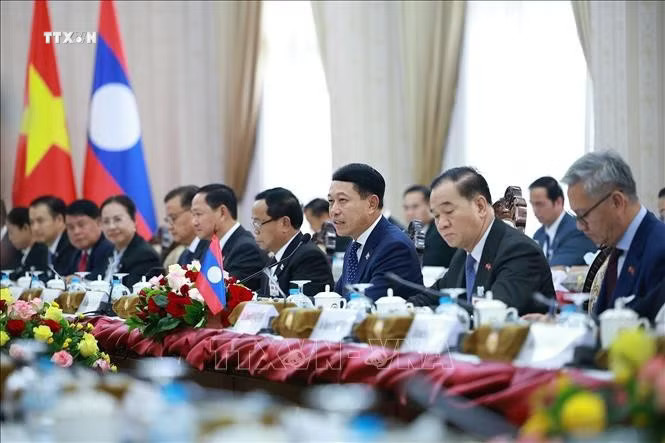 y1y9yg9qugfzdldclbjqbsp5nnmg-_vna_potal-thu-tuong-le-minh-hung-hoi-dam-voi-thu-tuong-lao-saleumxay-kommasith-stand-3910.jpg.avif