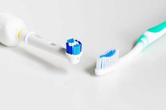 Should I use a regular toothbrush or an electric toothbrush?