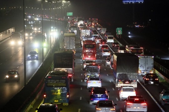 At midnight, a long line of cars inched away from the capital.