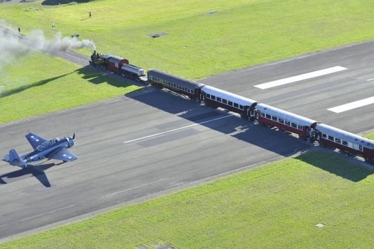 Unique airport with railway crossing the runway