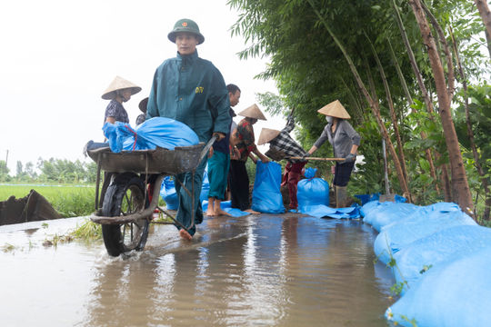 Race to drain floodwater and minimize damage after heavy rains