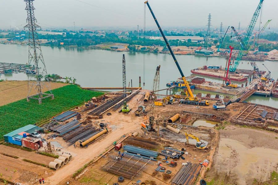 Bustling construction site of Thai Binh river bridge
