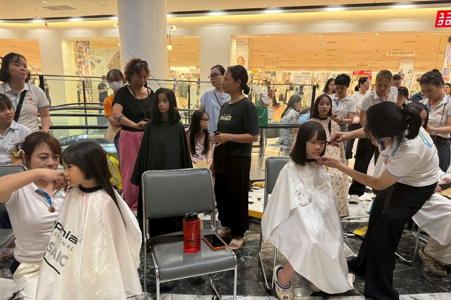 350 people donate hair to support children with cancer at blood donation festival